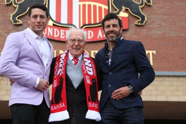 SAFC legend Julio Arca presents tickets for this month's FA Cup final to veteran Sunderland fan George Forster. Also pictured is Johnny Escobar from Play Ojo. Picture by Tom Banks