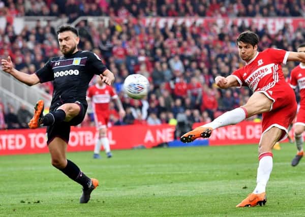 Villa's Robert Snodgrass tries to block a George Friend volley for Boro. Picture by Frank Reid