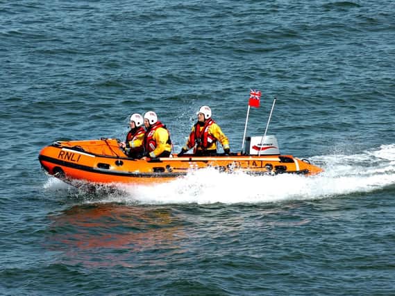 RNLI volunteers launched to rescue jet skier.
