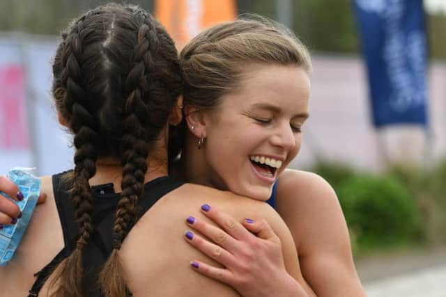 Half Marathon women's winner Eleanor Hunt gets a celebratory hug. Picture by Kevin Brady