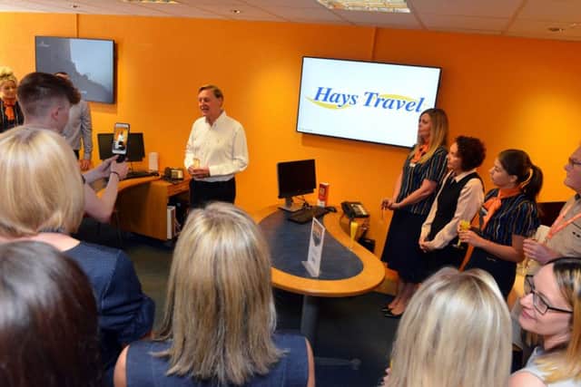John Hays makes the announcement that his firm Hays Travel has achieved a Â£1billion turnover, with staff to be given a bonus.