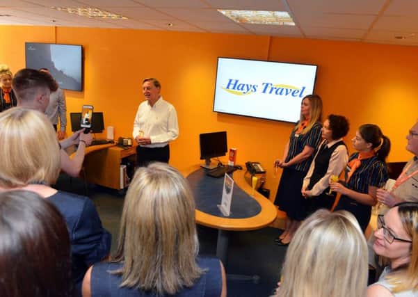 John Hays makes the announcement that his firm Hays Travel has achieved a Â£1billion turnover, with staff to be given a bonus.