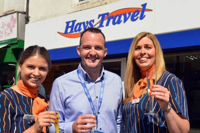 Hays staff Gabrielle Hogg, Jonathon Woodall and store manager Sharon Clyde celebrate their bonus.