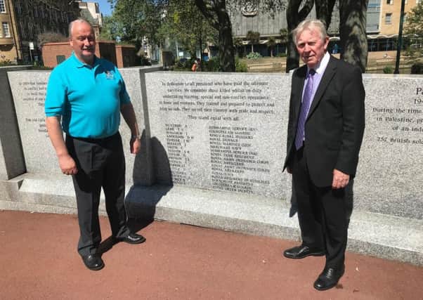 Graham Hall, chairman of the Sunderland Armed Forces Network, left, with Sunderland City Council's Armed Forces Champion Coun Harry Trueman at the Memorial Wall in Burdon Road.