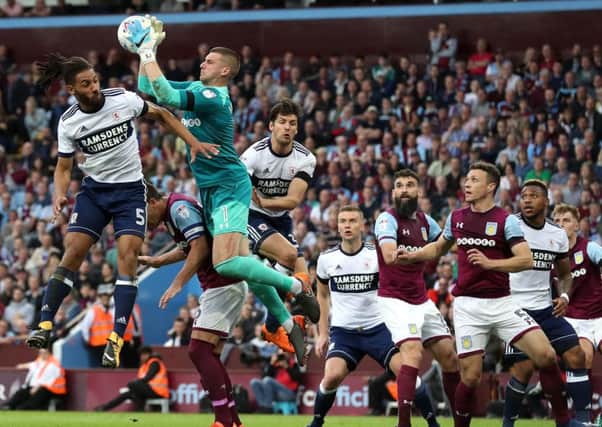 Boro defender Ryan Shotton loses out on a cross as Villa keeper Sam Johnstone makes a clean catch last night.
