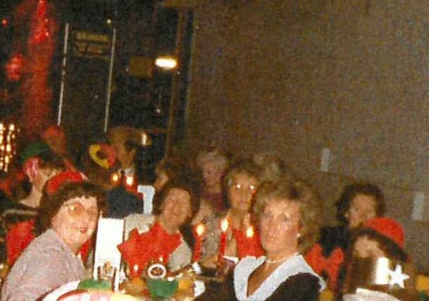 Jean Davis, in the black dress, is pictured at a Christmas party with colleagues from Luxdon's laundry.
