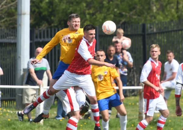 Sunderland West End (yellow) scrap against Silksworth CW in the TWR Shipowners' Charity Cup Final.