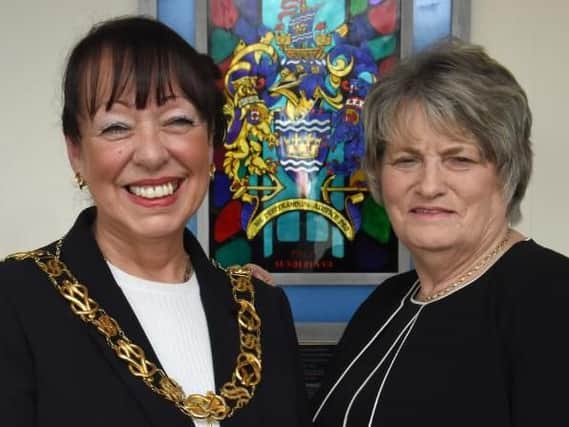 Coun Lynda Scanlan takes over the ceremonial chains of office from Coun Doris MacKnight to become the new Mayor of Sunderland.