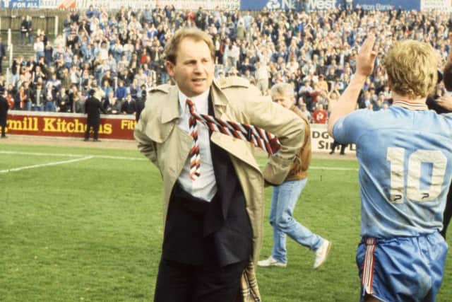 Denis Smith celebrates clinching promotion from the Third Division at Port Vale in 1988.