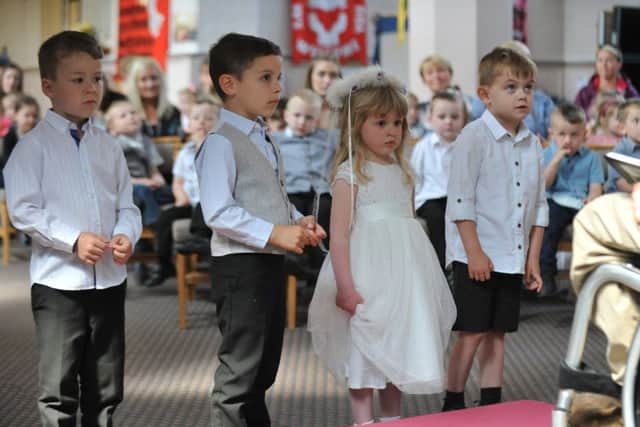 Youngsters from Fatfiled Academy take part in their own Royal Wedding at St George's Church.