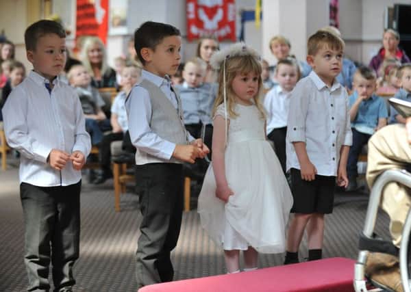 Youngsters from Fatfiled Academy take part in their own Royal Wedding at St George's Church.