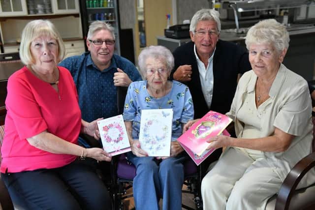 Peggy McMann celebrates her 103rd birthday with four of her children (left to right) Kathleen Smith, Peter McMann, Joe McMann and Brenda Mackin.