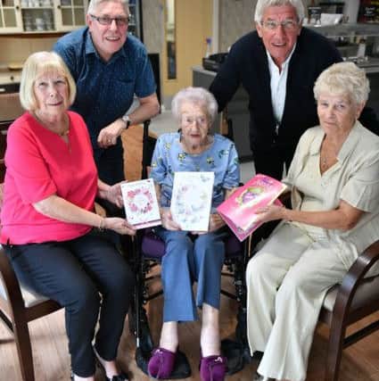 Peggy McMann celebrates her 103rd Birthday with four of her children (left to right) Kathleen Smith, Peter McMann, Joe McMann and Brenda Mackin.