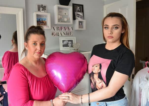 Chloe Park (17) with her Mum Janette Park (50) photographed in front of Chloe's memorial of the day holding a balloon they are going to release in Manchester. Picture by FRANK REID