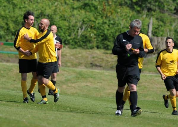 Penshaw Catholic Club (yellow) celebrate scoring in the Robson Pattison Cup final against Heaton Stannington. Picture by Stu Norton