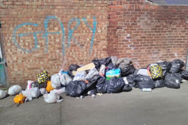 Rubbish dumped in a back lane behind Hendon Burn Avenue in Hendon, Sunderland.