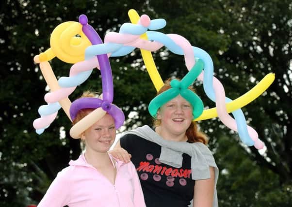 Roxeanna Gibson and Ashley Cook, both 13, sported some unusual headgear when Cherry Knowle Hospital held its annual garden fete in August 2004.