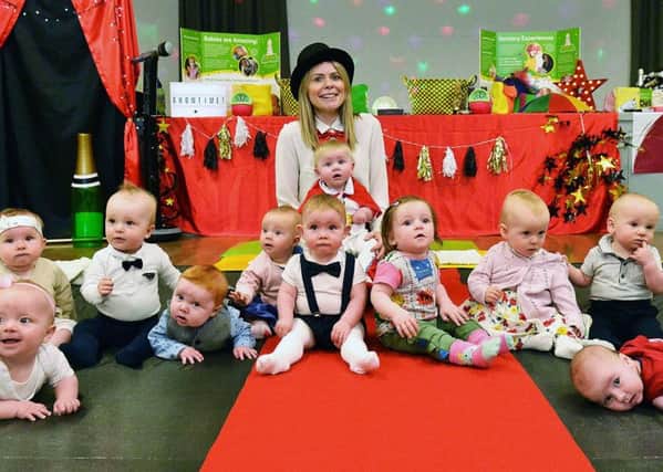 Rachel Mason with babies dressed up for the Tommy's campaign.