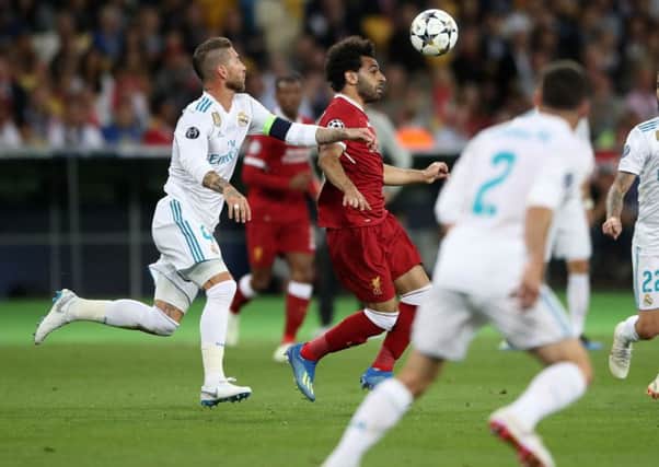 Real Madrids Sergio Ramos chases down, then brings down, Liverpools Mohamed Salah in the Champions League final.